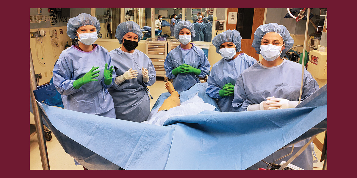 New Hampshire Master of Physician Assistant Studies students Amanda Seale, Sydney Hanford, Morgen Smith, Bianca Dorsey and Michelle Blouin during scrub training at Dartmouth-Hitchcock Medical Center